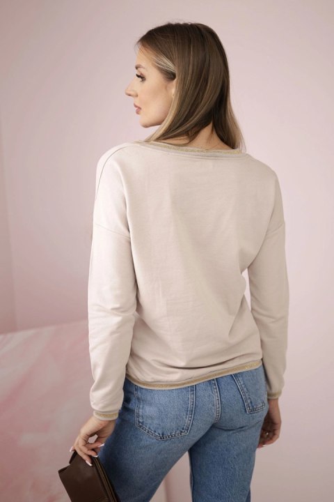 Bluza damska z napisem z cekinami beżowa Bluza damska z napisem z cekinami beżowa