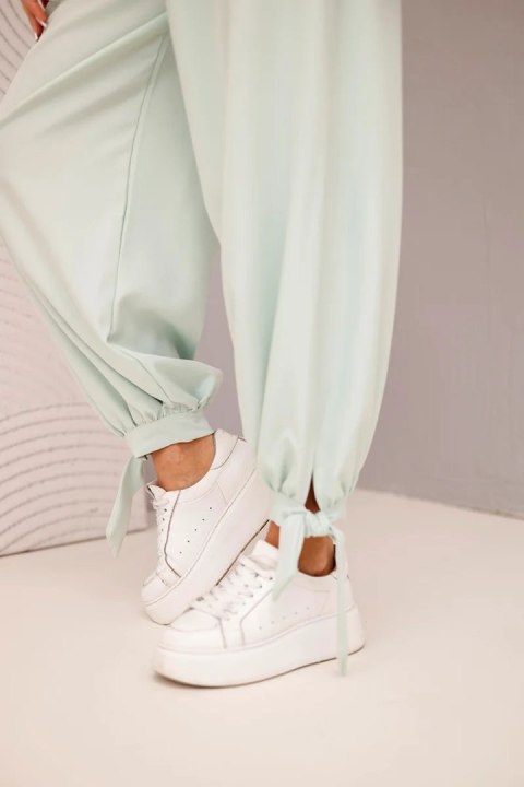 Spodnie damskie z szeroką nogawką i wiązaniem u dołu ciemno miętowe