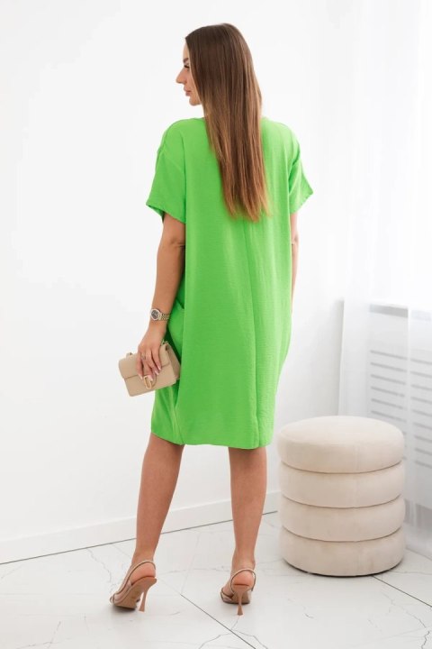 Sukienka z kieszeniami i wisiorkiem pistacjowa