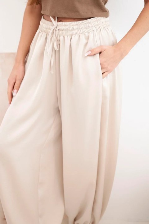 Spodnie damskie szerokie z gumką w pasie i wiązaniem typu alladynki beżowe