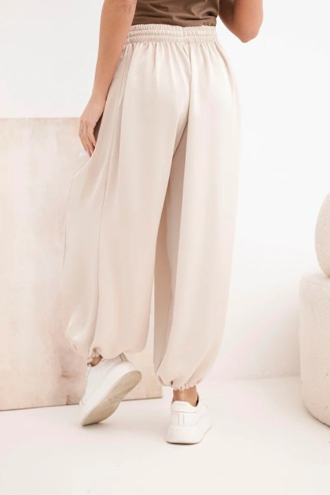 Spodnie damskie szerokie z gumką w pasie i wiązaniem typu alladynki beżowe